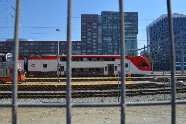 Caltrain #304 behind the fence in San Francisco