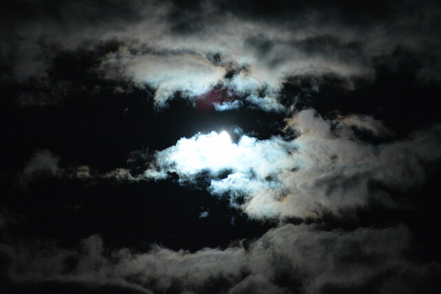 Clouds obscure the partial solar eclipse