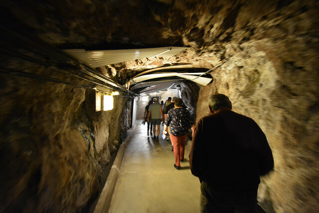 Tour group walks through a tunnel in Hoover Dam