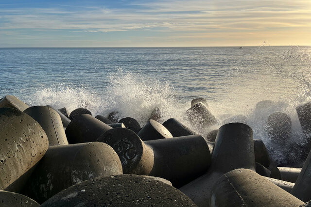 Waves crash on tetrapods