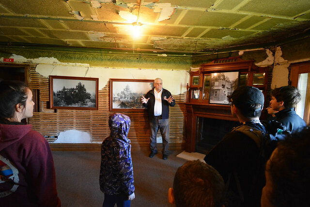 Tour guide explains earthquake damage