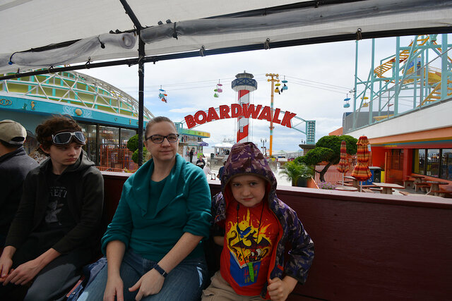 Calvin, Kiesa, and Julian on the beach train at the boardwalk