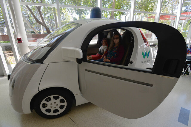 Julian and Kiesa in a Waymo concept car