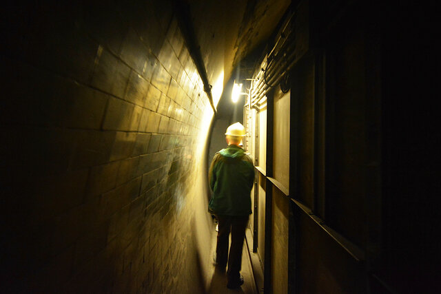 Walking through the narrow hallways in Down Street station