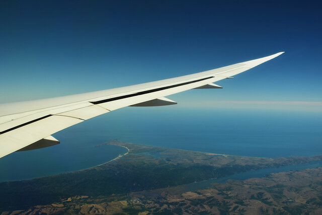 787 wing descending over Point Reyes