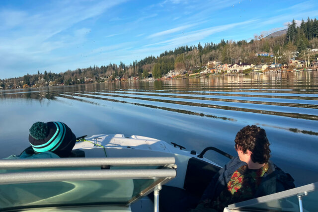Riding in a boat on Big Lake