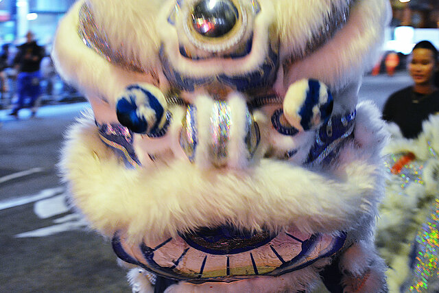 Up close with a lion dance at the edge of the parade