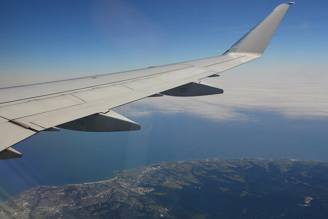 E-175 wing flying over Santa Cruz