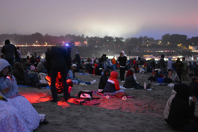 Dusk falls on the crowd at Crissy Field