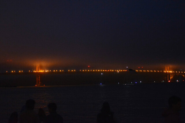 The Golden Gate Bridge, visible only by streetlights