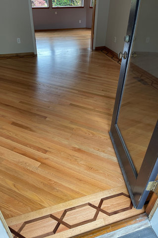 Refinished wood floor in dining room