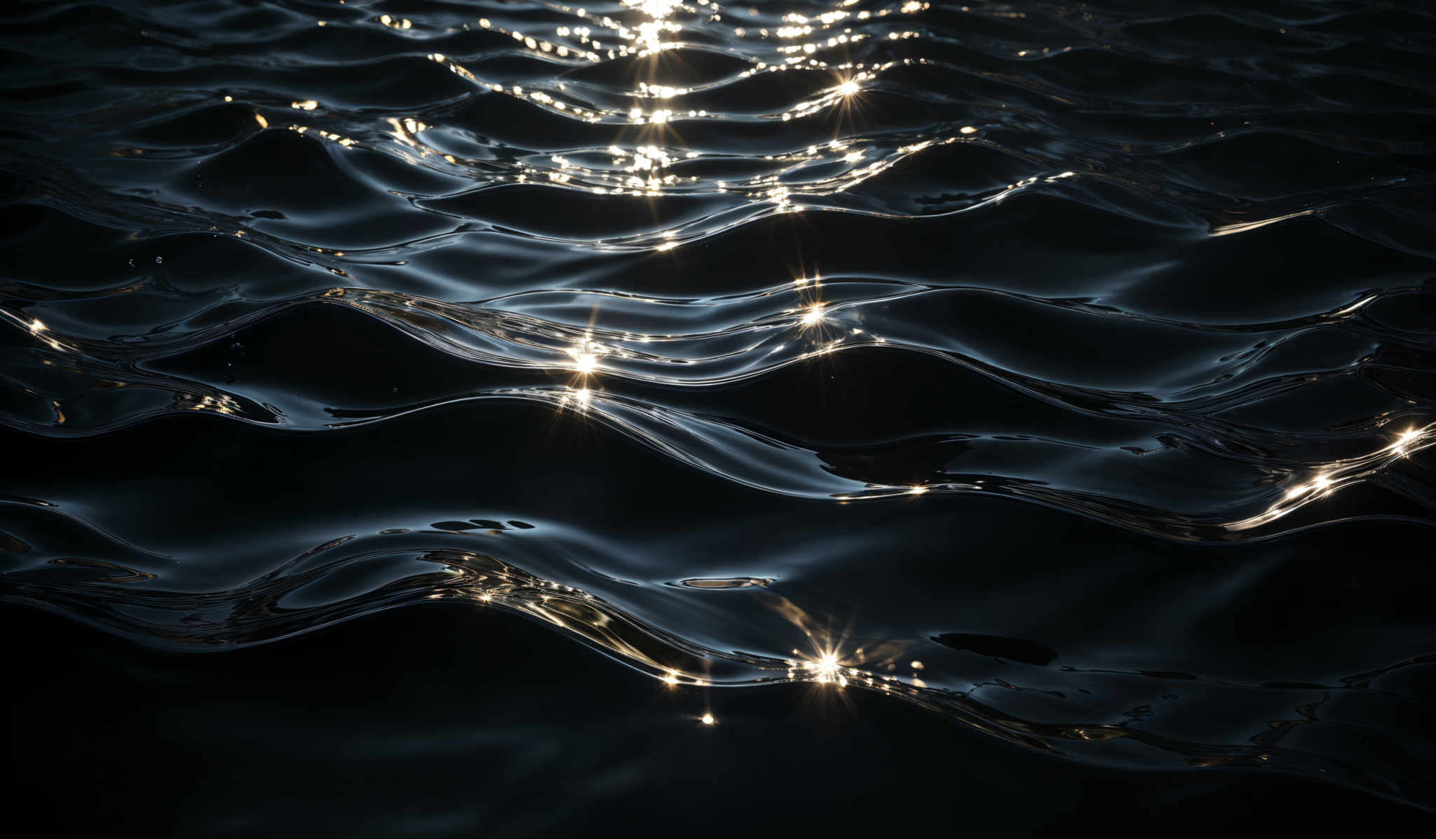 The image showcases a dark, almost black background with wavy patterns that resemble ripples on water. These patterns are illuminated by bright, sparkling lights that appear to be reflecting off the water's surface. The lights create a shimmering effect, giving the image a magical and ethereal quality.