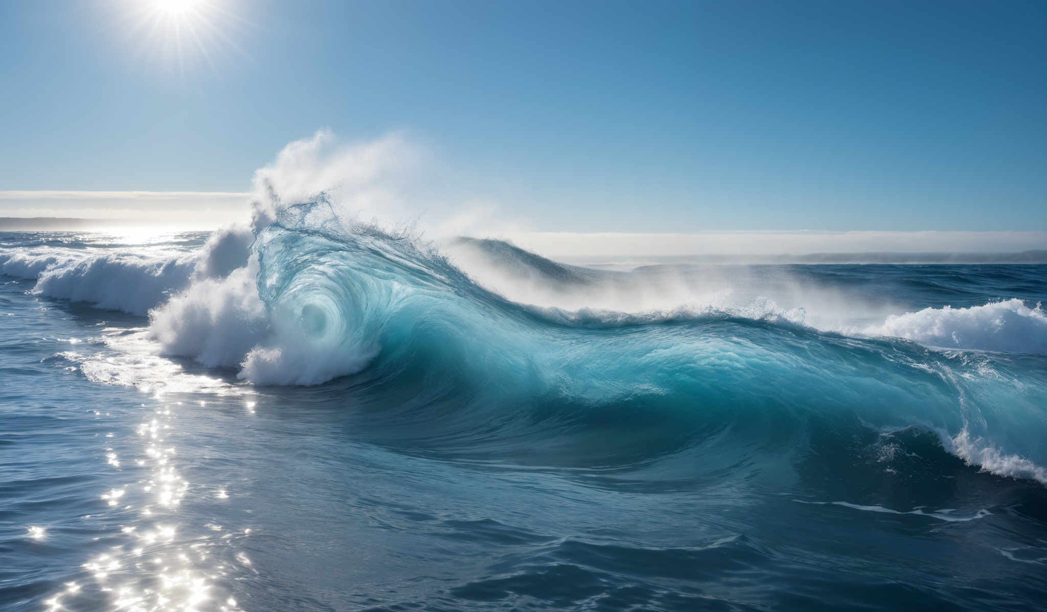 The image showcases a beautiful seascape with a large wave crashing. The wave is a vibrant shade of turquoise, transitioning to a white frothy crest. The sun is shining brightly in the sky, casting a radiant glow on the water. The horizon shows a distant landmass, and the sky is clear with a few scattered clouds.