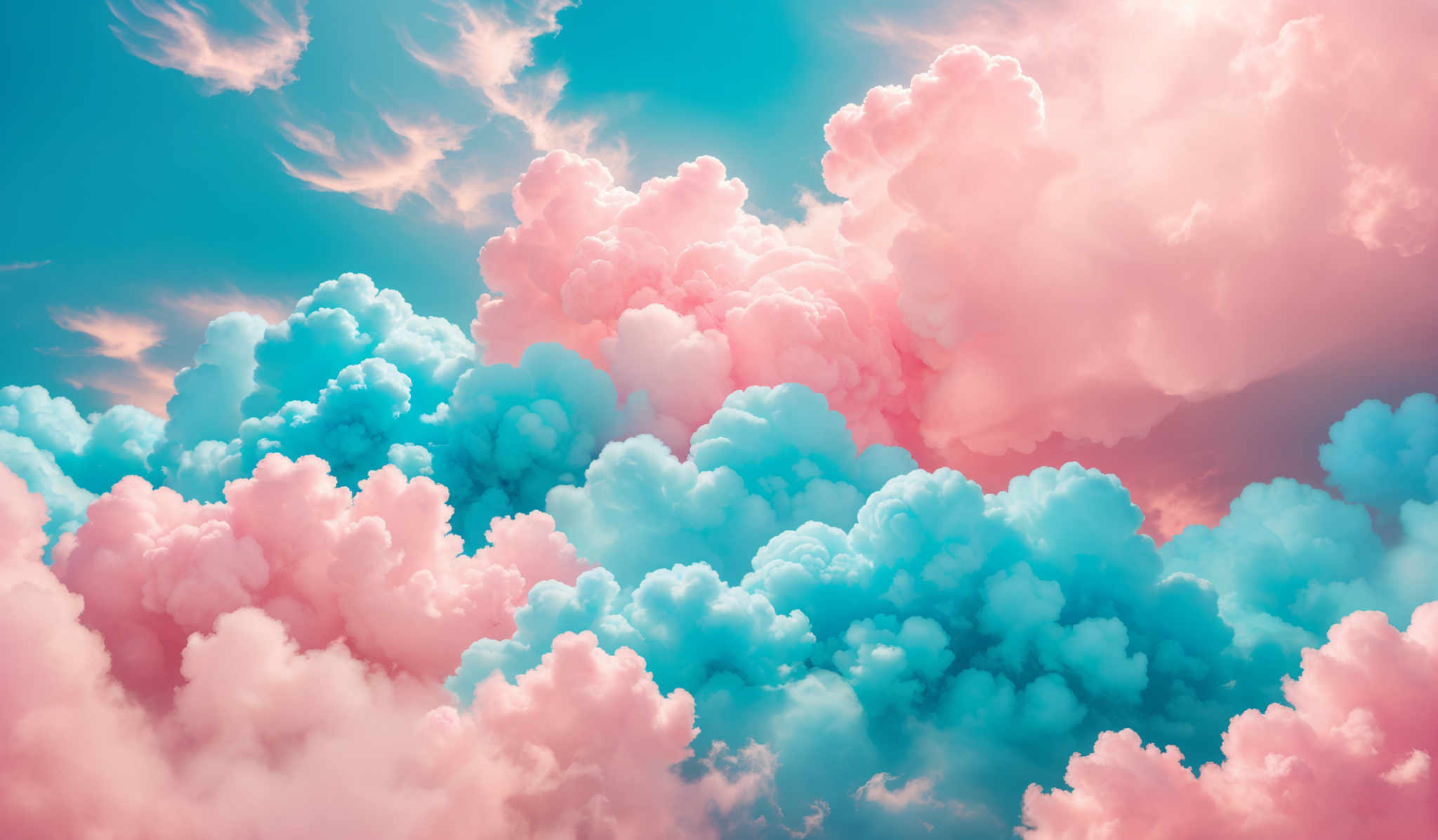 The image showcases a breathtaking view of clouds. The clouds are depicted in various shades of pink, blue, and white. They are fluffy and voluminous, with some appearing as towering cumulus formations while others are more wispy and spread out. The sky behind the clouds is a vibrant shade of blue, with streaks of white, possibly indicating the presence of high-altitude clouds or the reflection of sunlight.