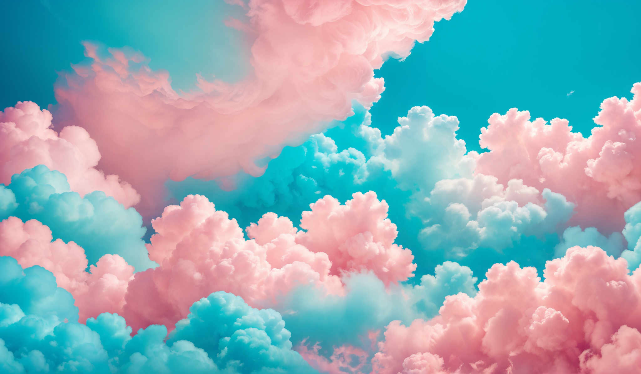 The image showcases a breathtaking view of cumulus clouds. The clouds are depicted in a myriad of colors, including shades of pink, blue, and white. They are fluffy and billowing, with some clouds appearing larger and more dense than others. The play of colors gives the clouds a dreamy and ethereal appearance. The background is a clear blue sky, which contrasts beautifully with the vibrant colors of the clouds.