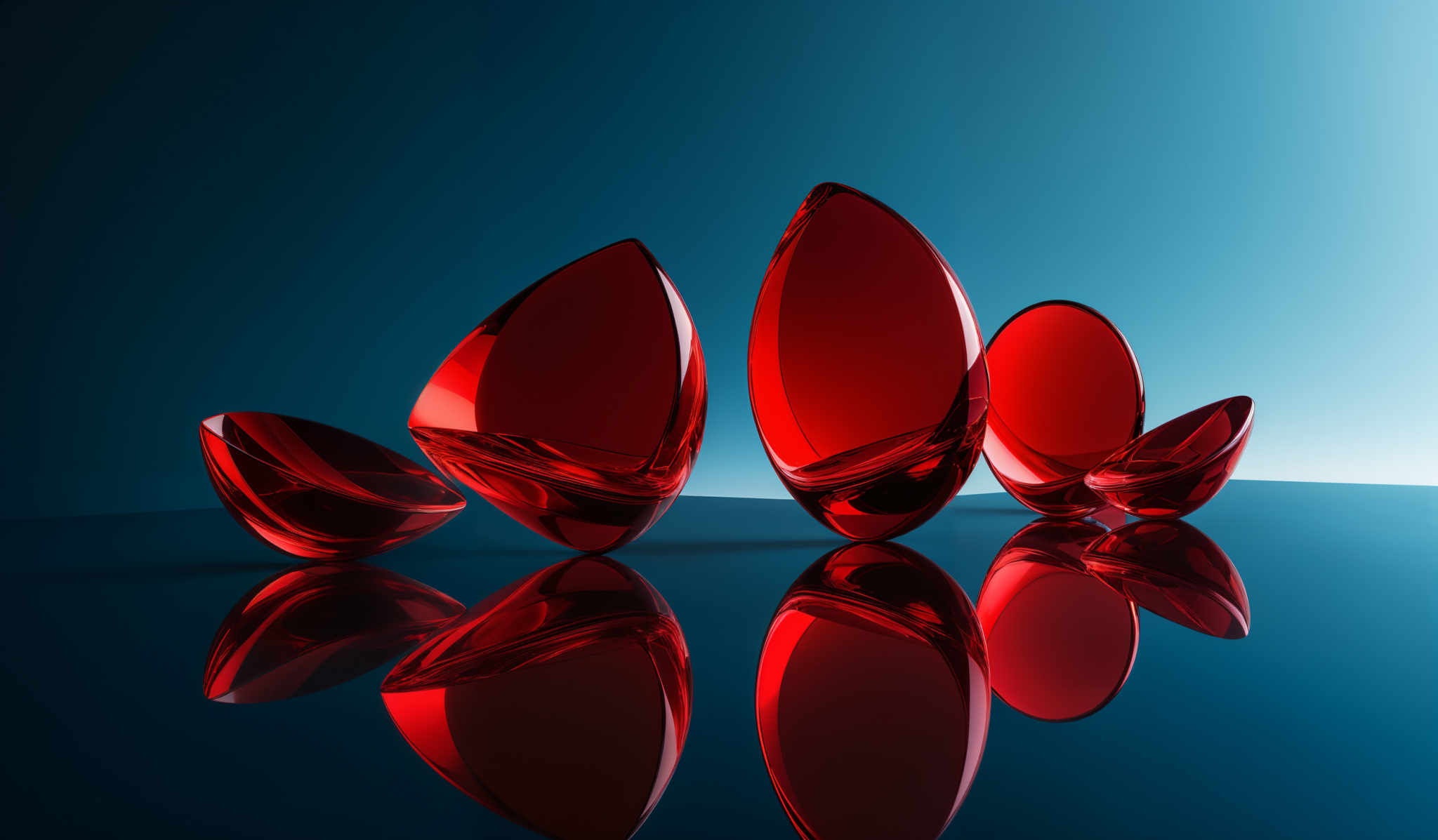 The image showcases vibrant red, oval-shaped objects that appear to be made of glass or a similar transparent material. These objects are placed against a gradient background transitioning from deep blue at the top to a lighter blue at its bottom. The objects reflect their surroundings, creating a mirrored image on the surface beneath them. The reflections, combined with the objects' translucent nature, give the image a shimmering and ethereal quality.