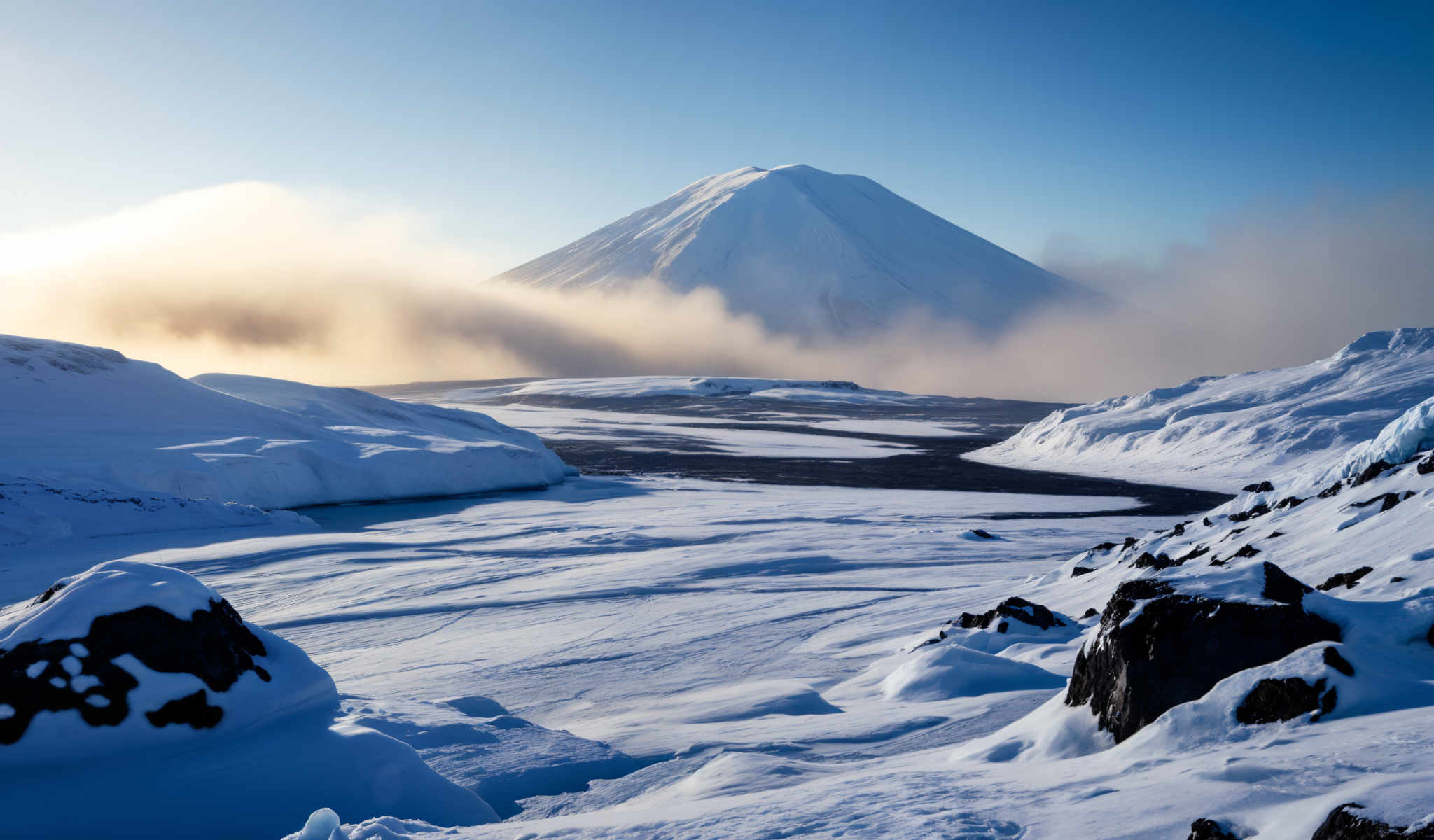 A snowy mountain with a blue sky in the background.