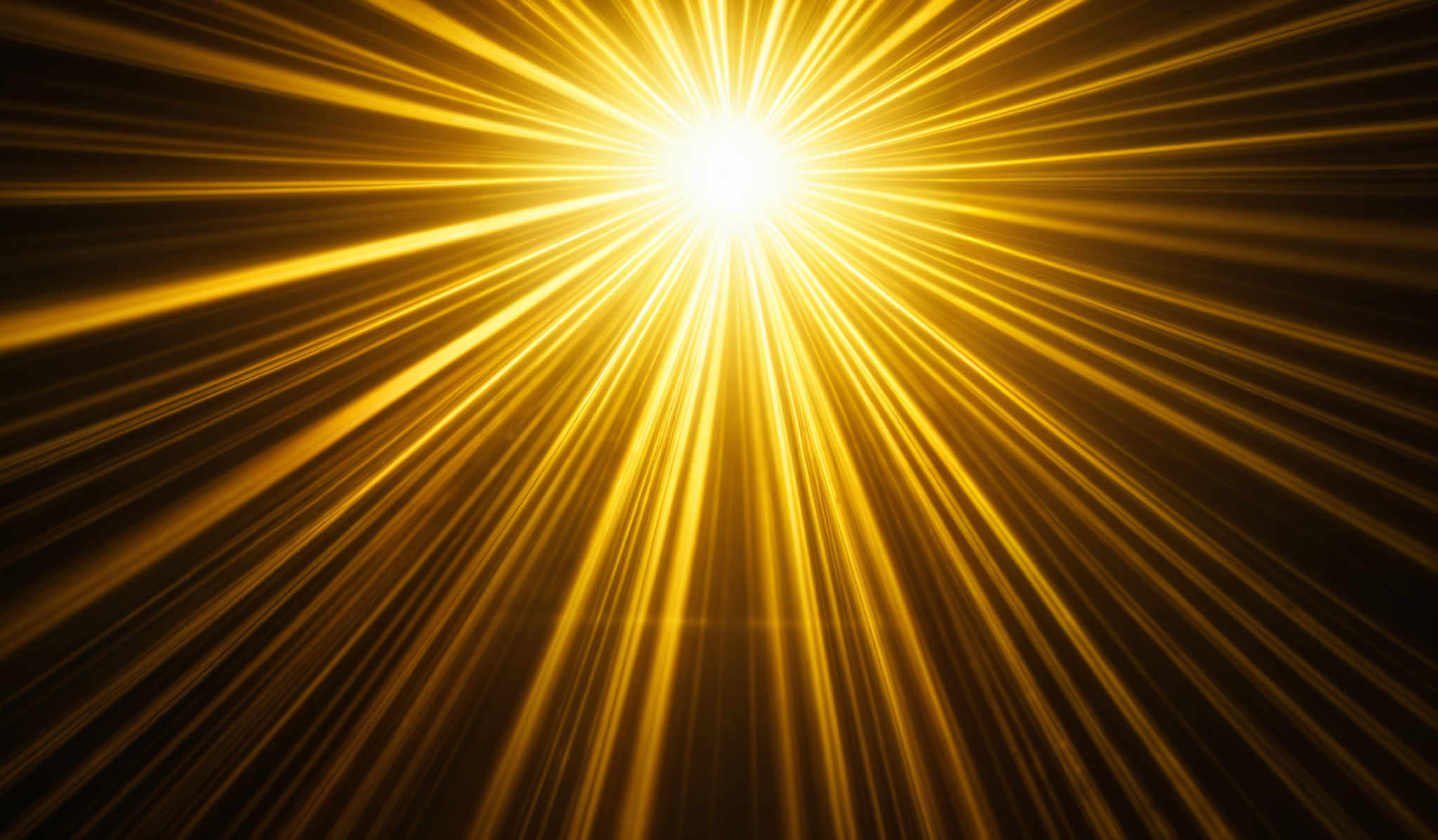 The image showcases radiant beams of light emanating from a central point. These beams are golden-yellow in color and appear to be converging towards the center. The background is dark, which accentuates the brightness and intensity of the light beams. The overall shape is reminiscent of a starburst or explosion, with the light rays spreading outwards in multiple directions.