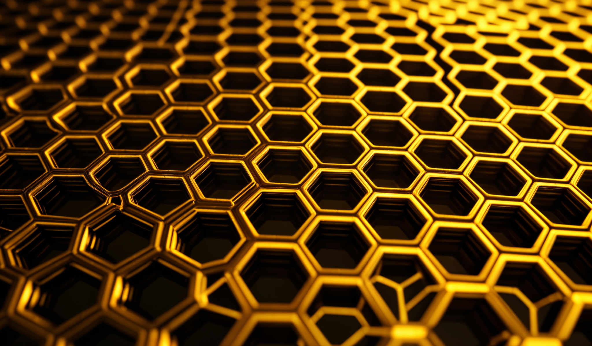 The image showcases a close-up view of a hexagonal pattern. The hexagons are arranged in a honeycomb-like structure, and they are illuminated in a golden hue. The depth of the image gives a three-dimensional effect, making the hexagones appear raised and giving a sense of texture and depth.