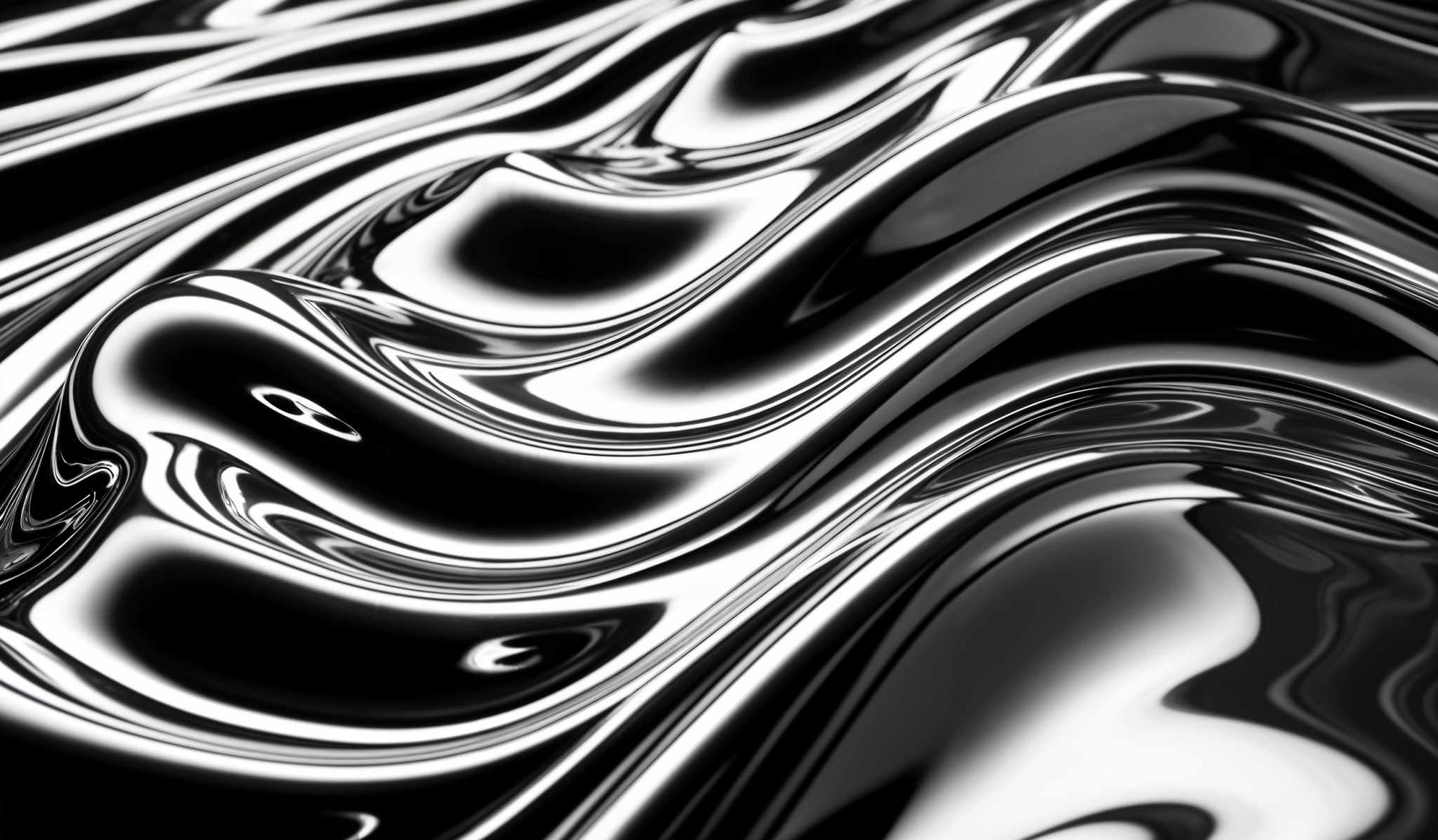 The image showcases a glossy, reflective surface with undulating, wavy patterns. The dominant colors are black and white, with the black forming the base and the white highlighting the raised areas, creating a contrast that accentuates the fluidity of the patterns.