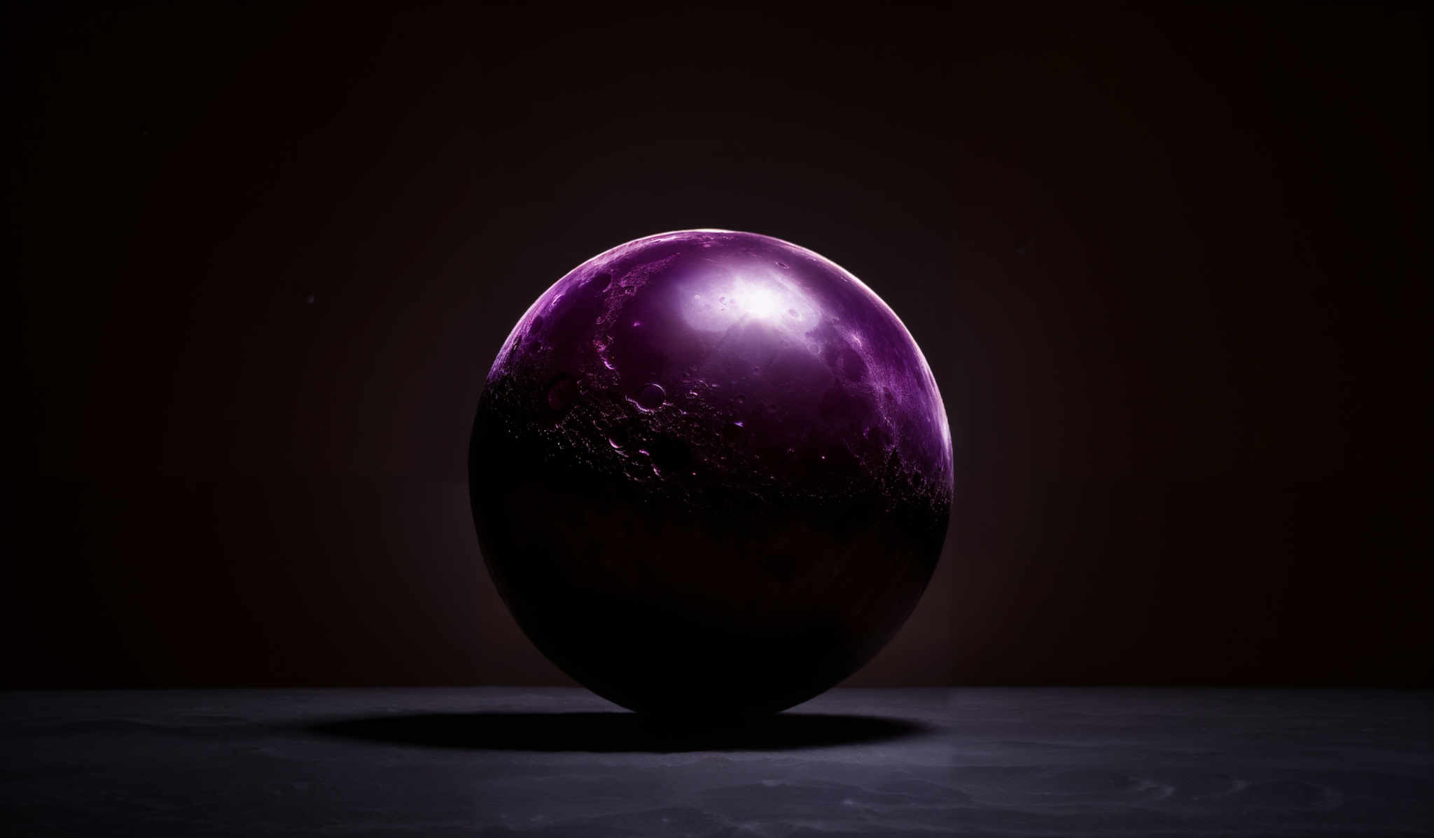 The image showcases a spherical object that appears to be a representation of a celestial body, possibly a moon or planet. It is predominantly in shades of purple and pink, with intricate patterns resembling craters and surface irregularities. The background is dark, emphasizing the luminosity of the object, and there are subtle light reflections on its surface.