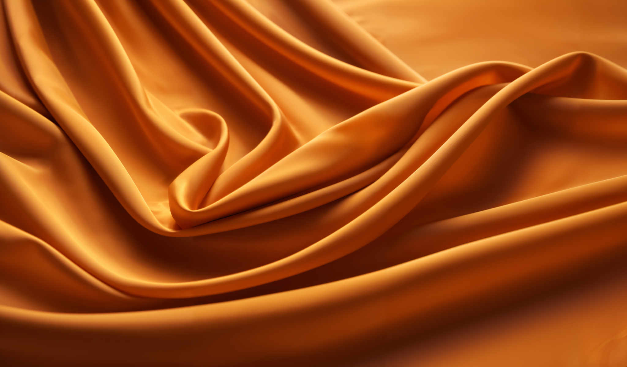 The image shows a close-up of a piece of orange fabric. The fabric appears to be made of a shiny material possibly silk or satin. It has a crinkled texture giving it a sense of depth and movement. The color of the fabric is a vibrant orange with some areas appearing darker than others suggesting shadows or folds in the material. The image is taken from a low angle looking up at the fabric which adds a sense drama and intensity to the scene. The focus is on the fabric itself with no other objects or background visible. The overall impression is of luxury and elegance.