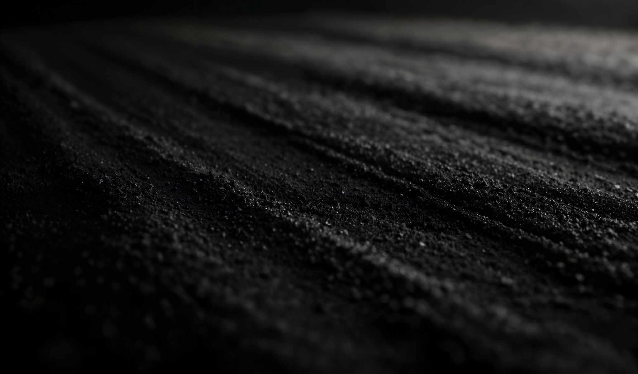 A close up of a black surface with a striped pattern.