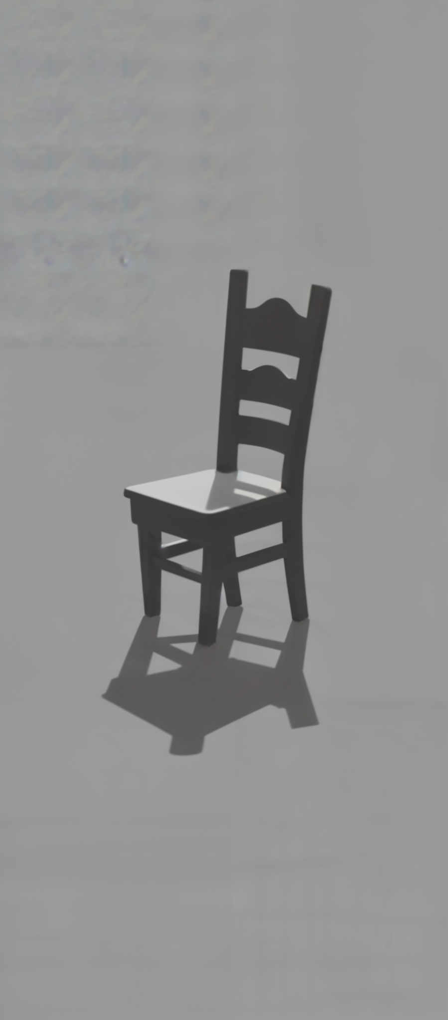 The image presents a solitary black chair standing alone against a stark white background. The chair with its curved backrest and armrests exudes a sense of solitude and simplicity. The monochrome color scheme enhances the minimalist aesthetic of the scene. The absence of any other objects in the image further emphasizes the chair's isolation. The image evokes a sense calmness and tranquility inviting the viewer to contemplate the chair in its solitude.