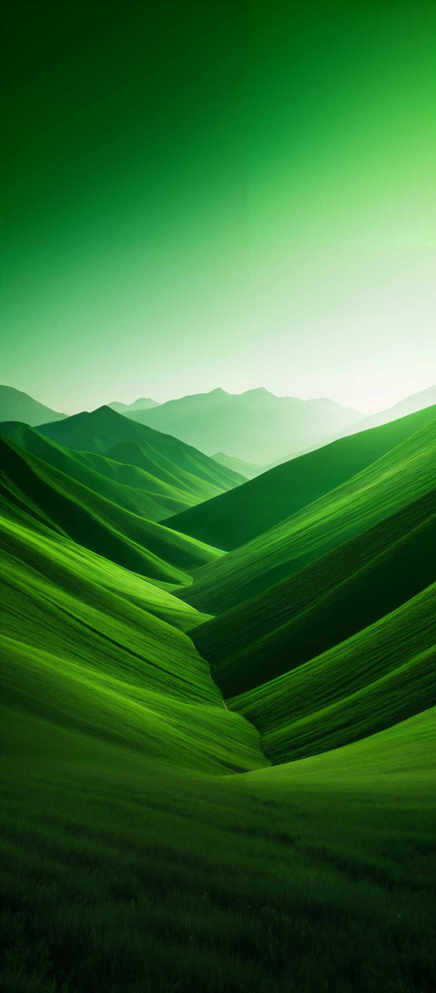 The image showcases a vast expanse of rolling green hills. The hills are characterized by smooth curves and gentle slopes, creating a serene and undulating landscape. The color palette is dominated by various shades of green, ranging from light to dark, which gives the image a fresh and vibrant feel. In the background, there are faint silhouettes of mountains, adding depth to the scene. The sky above is a gradient of greenish-blue, suggesting either early morning or late afternoon light.