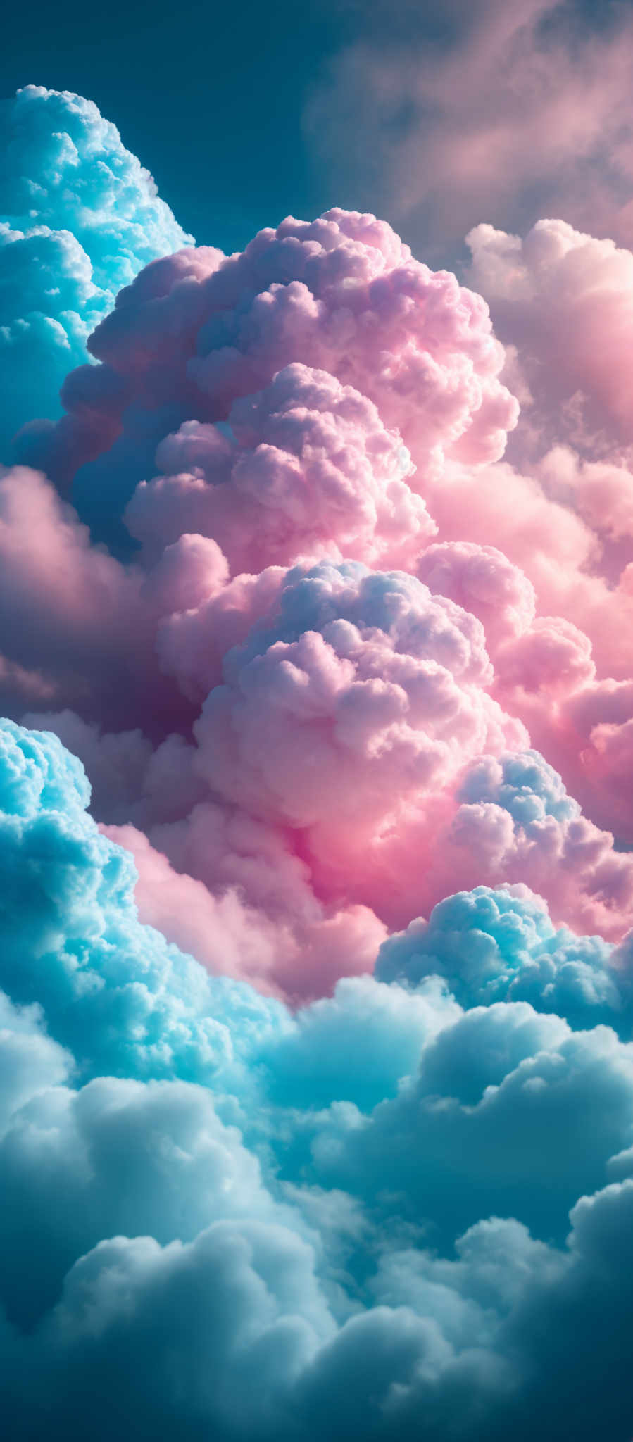 The image showcases a breathtaking view of cumulus clouds. The clouds are densely packed and exhibit a variety of colors, ranging from soft pink and lavender to deep blue and turquoise. The shapes of the clouds are fluffy and billowing, with some appearing as towering giants while others are more scattered and wispy. The play of light and shadow on the clouds adds depth and dimension, making them appear both majestic and ethereal.