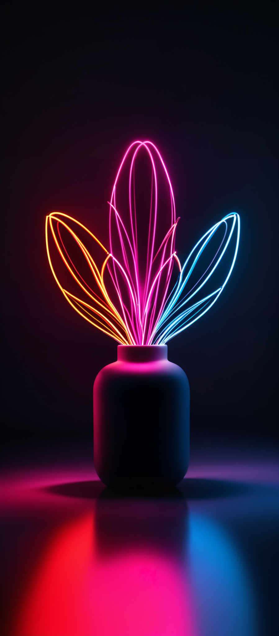 The image showcases vibrant neon lights in a dark setting. The primary colors are pink, orange, and blue. The shape is reminiscent of a flower or a bouquet, with neon petals radiating outwards from a central stem. The petals are curved and have a smooth, glowing appearance. They are placed in a vase or container, which is dark and contrasts with the bright lights. The reflection of the lights can be seen on the surface below, adding depth to the image and enhancing the vividness of the colors.