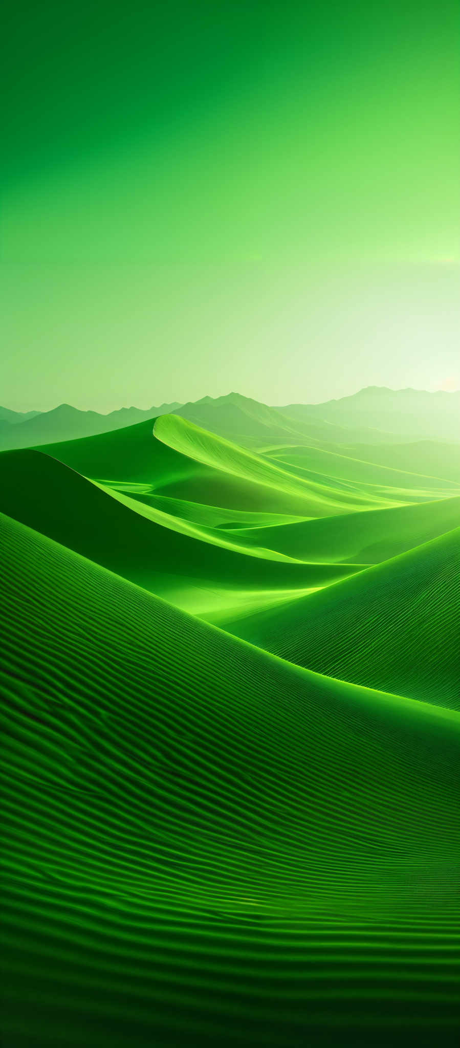 The image showcases a vast expanse of rolling sand dunes with a mesmerizing gradient of green hues. The dunes have intricate patterns, likely formed by the wind, and their curves create a sense of movement and fluidity. The sky above is clear with a gradient of light green, suggesting either dawn or dusk. In the distance, there are faint silhouettes of mountains, adding depth and contrast to the scene.