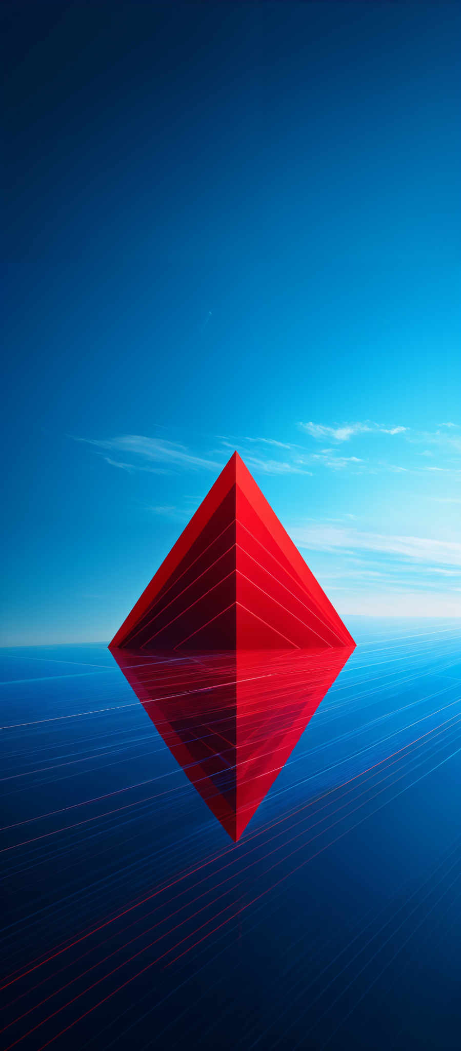 The image showcases a vibrant and surreal scene. Dominating the center is a large, pyramid-shaped object with a gradient of red to orange hues. This pyramidal structure is reflected perfectly on a calm, reflective surface below, creating a mirror image. The background is a vast expanse of deep blue, transitioning to a lighter shade near the horizon. Above, the sky is clear with a few wispy clouds. The entire image exudes a sense of tranquility and symmetry.