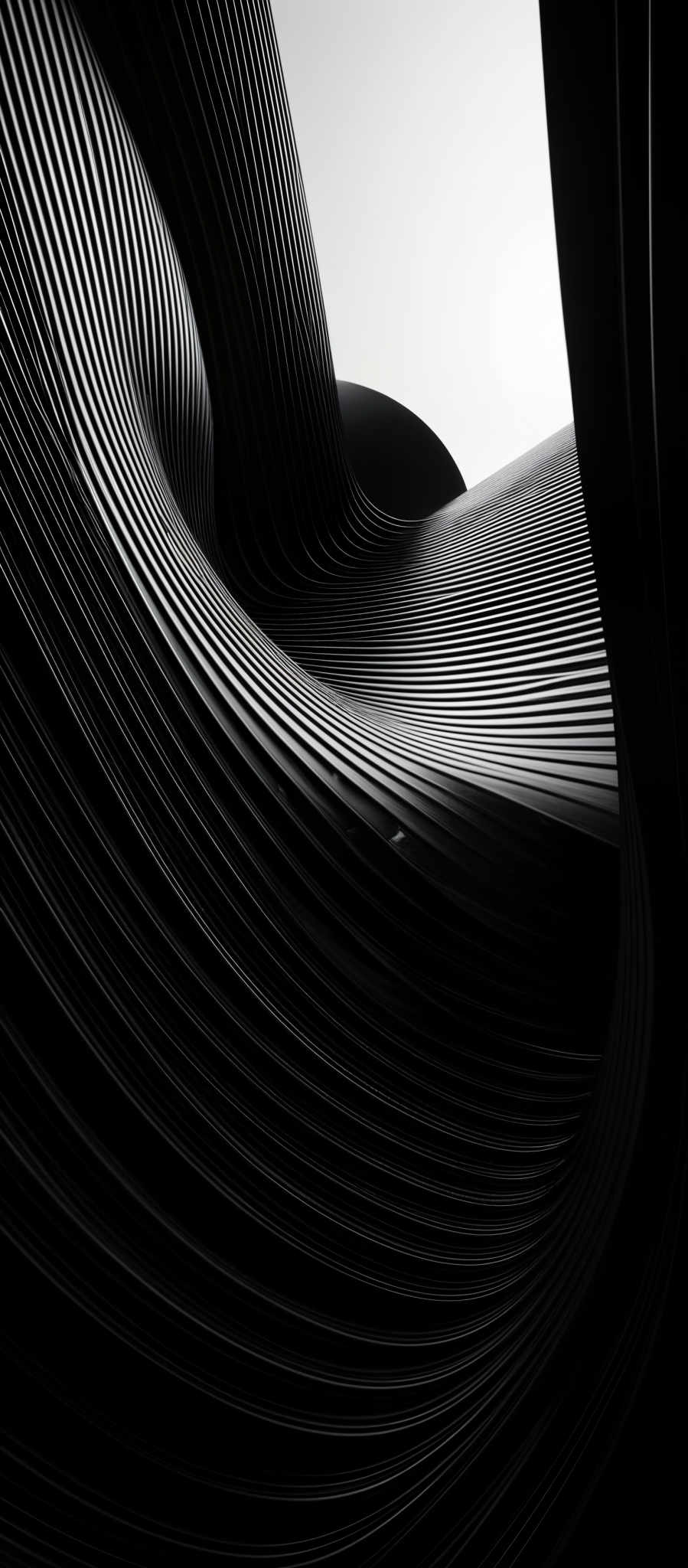 The image showcases a black and white photograph of a highly intricate architectural structure. The structure features flowing, curved lines that appear to be made of metal or some other material. These lines create a mesmerizing pattern of ridges and grooves, giving the structure a sense of movement and fluidity. The photograph captures the play of light and shadow on these lines, emphasizing their depth and dimension. The overall shape is reminiscent of a wave or a ribbon, and the image exudes a senseof sophistication and modernity.