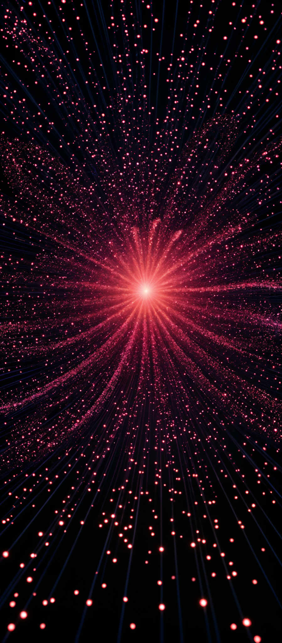 The image showcases a vibrant explosion of colors, predominantly red and pink, radiating outwards from a central point. The explosion is composed of numerous small, glowing dots that appear to be dispersing outwards in a radial pattern. The overall shape resembles a burst or explosion, reminiscent of a supernova or a cosmic event.