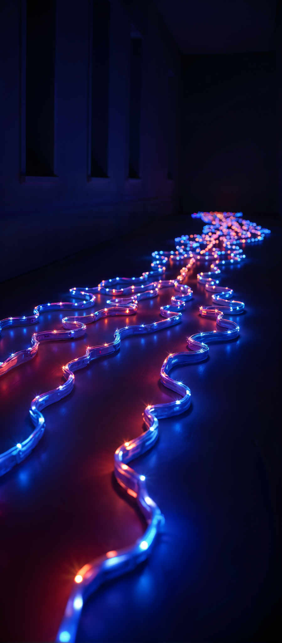 A long winding line of blue and red neon lights.