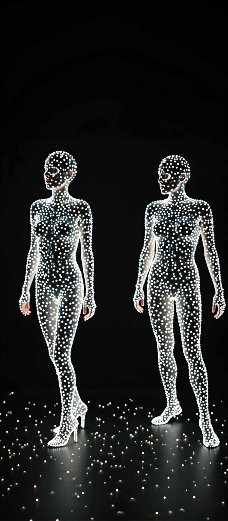 Two women are shown in a digital image. They are both wearing body suits and have their arms and legs covered in white dots. The woman on the left is facing the camera while the woman on right is facing away. The background is black which makes the white dots stand out. The image is a 3D rendering giving it a realistic appearance. The women's body suits are form-fitting highlighting their figures. The white dots on their bodies create a pattern that is both eye-catching and intriguing. The overall effect is a striking and memorable image.