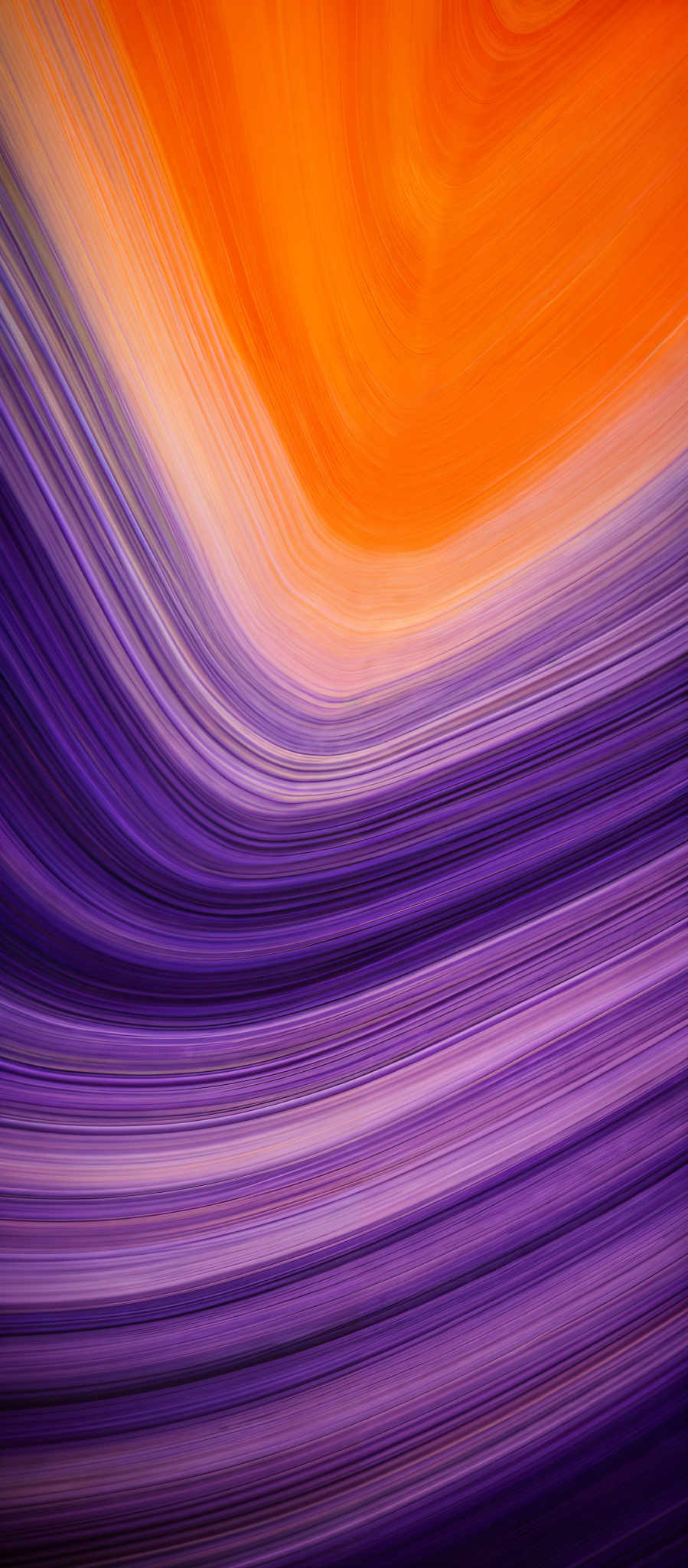 The image showcases a vibrant and dynamic swirl of colors. The dominant colors are shades of orange, purple, and white. The swirls are fluid and flowing, giving the image a sense of movement and energy. The shape resembles a wave or a fluid motion, with the colors transitioning smoothly from one hue to another.