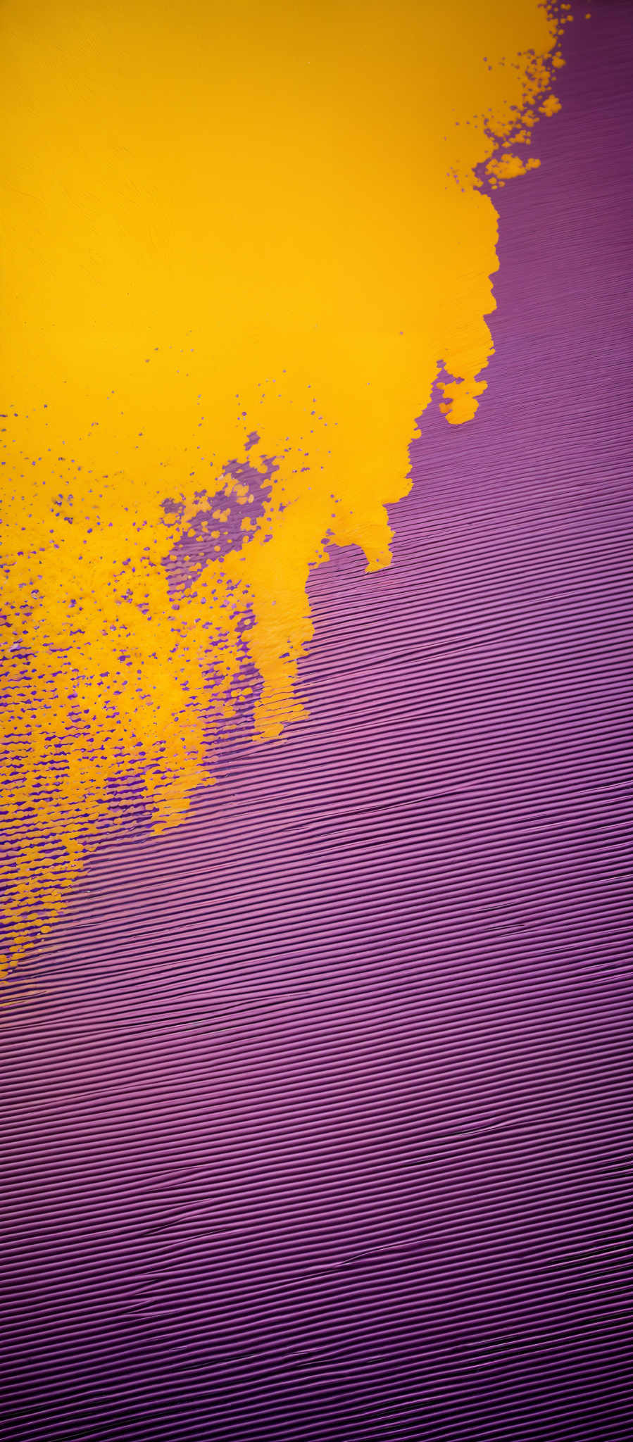 The image showcases a vibrant contrast between two primary colors: yellow and purple. The yellow forms a scattered, almost chaotic pattern, resembling a splash or a spill. This yellow is juxtaposed against a smooth, linear purple background. The purple has a consistent, rhythmic pattern, reminiscent of a ribbed fabric or a grooved surface.