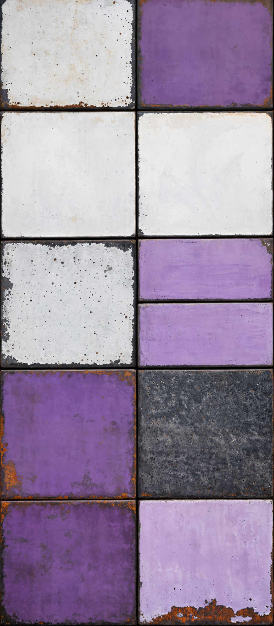 The image showcases a grid of rectangular tiles arranged in three rows and three columns. Each tile has a distinct color and texture. Starting from the top left, the first tile is white with a speckled texture, the second is a light purple with a slightly worn-out appearance, the third is a darker shade of purple, and the fourth is a rusty brown with a worn-off, chipped texture.