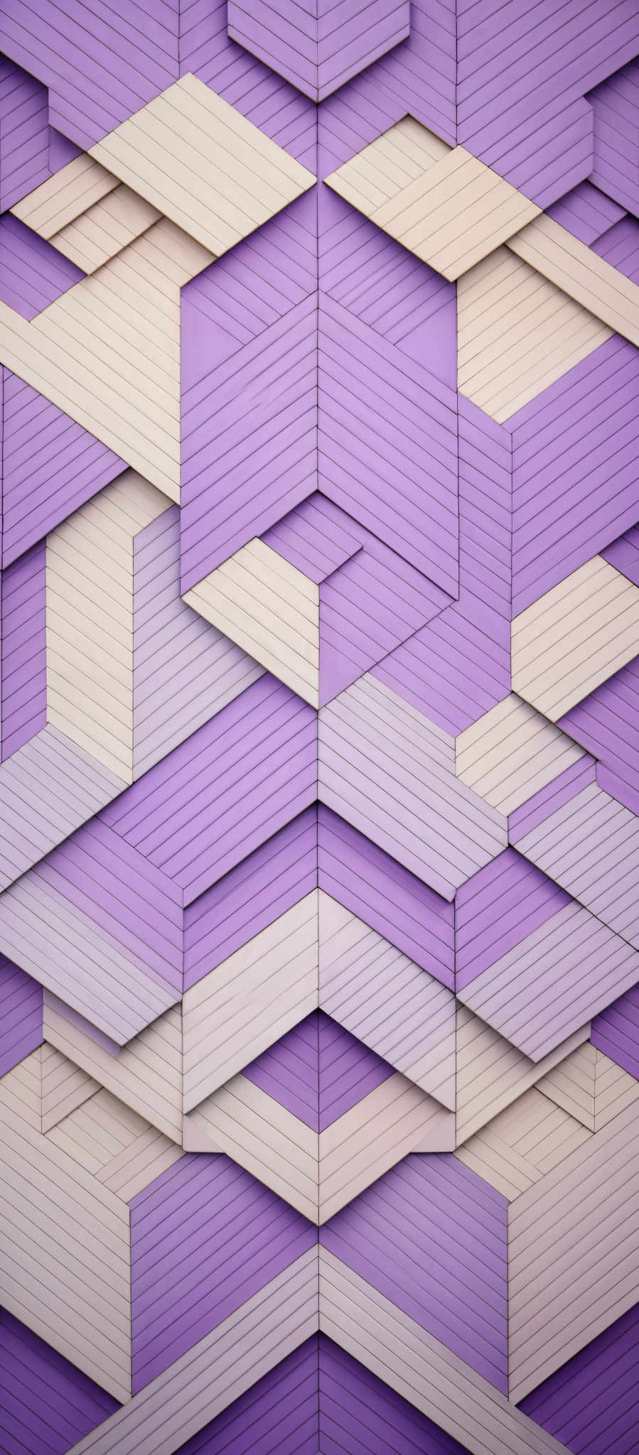 The image showcases a 3D geometric pattern with multiple layers of rectangular and trapezoidal shapes. The colors predominantly featured are shades of purple and beige. The shapes are intricately arranged in a way that creates a visually pleasing and dynamic effect, reminiscent of a crystalline or tessellated structure.