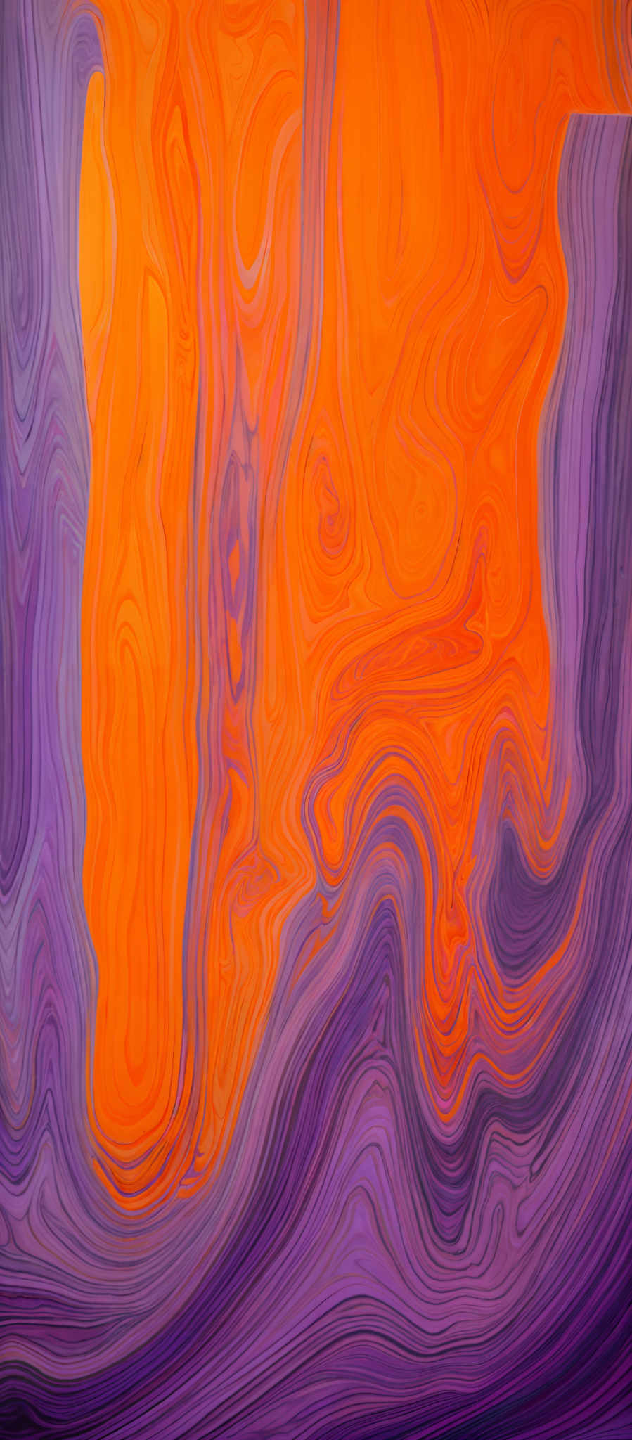 The image showcases a vibrant and intricate pattern of swirling colors. Dominant colors include shades of orange, purple, and blue. The swirls are fluid and wavy, creating a marbled or agate-like appearance. The patterns seem to flow and intertwine, creating an almost organic or natural texture.