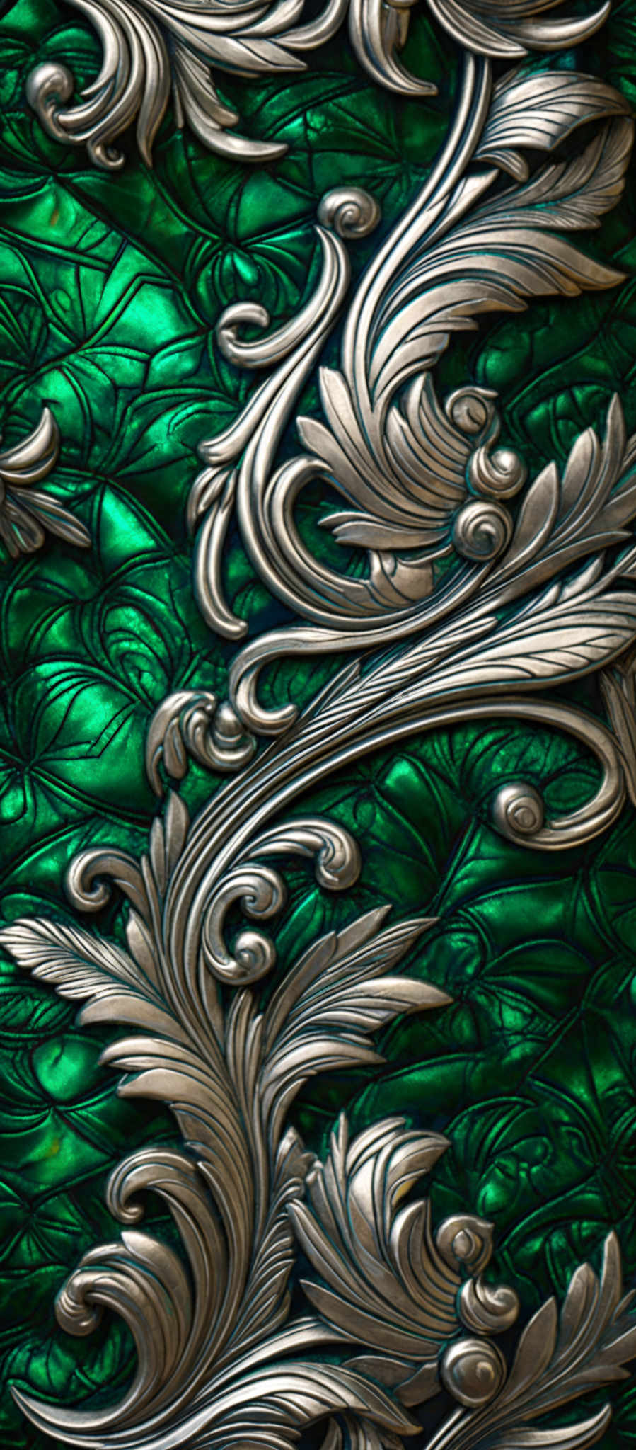 The image showcases a rich, ornate design with a combination of metallic and green hues. The metallics appear to be in a silvery-gray tone, while the green is a deep, almost emerald shade. The design features intricate swirls and patterns, reminiscent of floral motifs. The swirls are symmetrical and appear to cascade downwards, intertwining with each other. The background has a patterned texture, possibly resembling scales or a mesh, which complements the overall aesthetic of the design.