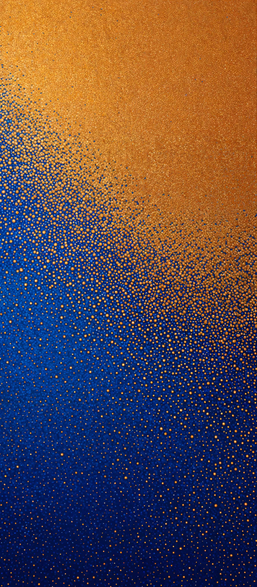 The image showcases a gradient transition from a deep blue at the top to a golden-yellow at the bottom. The top half is dominated by a deep, rich blue, while the bottom half is a shimmering golden- yellow, speckled with numerous small, round, and uniform dots. These dots give the impression of a shiny or glittery surface.