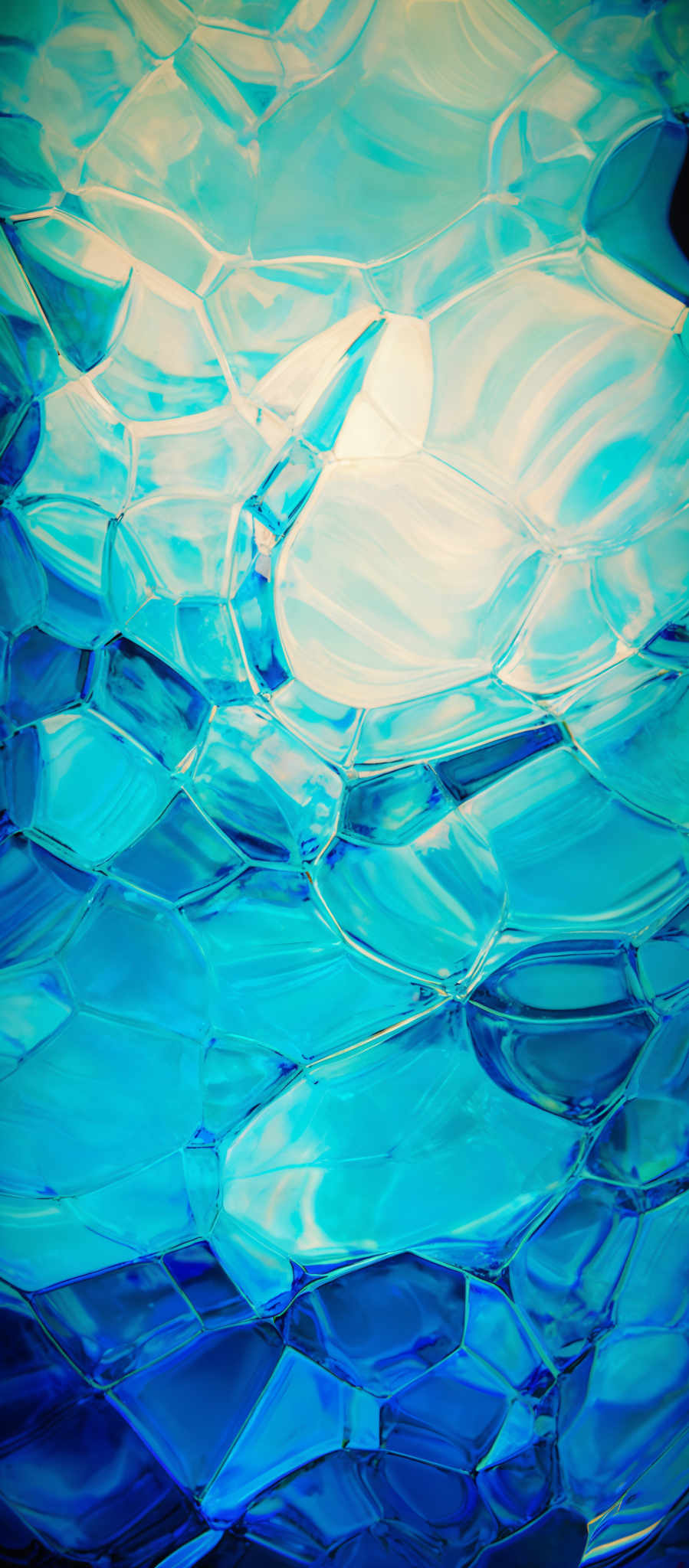 The image showcases a vibrant and intricate pattern of interconnected hexagonal shapes. These shapes are predominantly in shades of blue, ranging from light to dark. The interplay of light and shadow gives depth to the image, making the hexagons appear three-dimensional. The overall effect is reminiscent of a crystalline structure or a honeycomb, with the varying shades suggesting different angles and reflections of light.