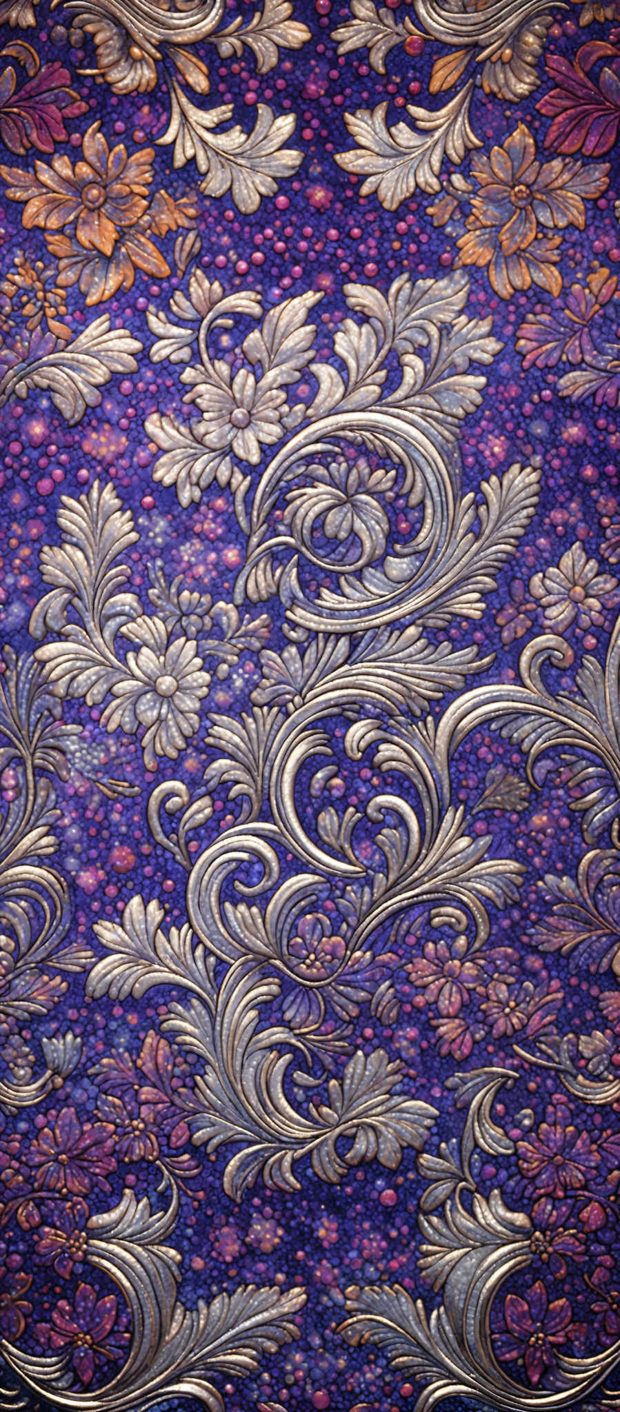 The image showcases a richly detailed and intricate pattern. The dominant colors are shades of purple, gold, and silver. The pattern consists of ornate swirls and floral motifs, with the swirls taking on a fluid, almost liquid-like appearance. The floral elements are composed of flowers and leaves, rendered in gold and silver, which contrast beautifully against the deep purple background. The overall effect is reminiscent of a luxurious fabric or wallpaper, evoking feelings of opulence and elegance.