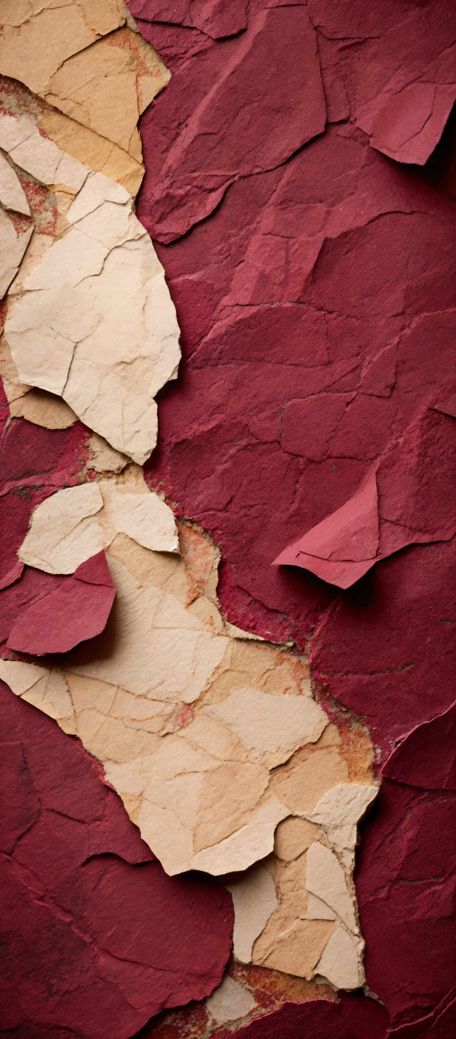 The image showcases a textured surface with layers of paint peeling off. The dominant colors are shades of red and beige. The peeling paint reveals a deeper, more worn-out layer beneath, showing signs of wear, cracks, and some rusty patches. The shapes are irregular, with overlapping layers of peeled paint, creating a complex and intricate pattern.