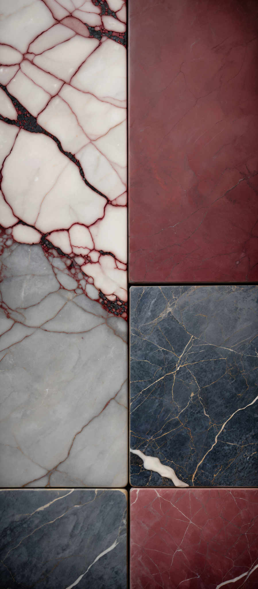 The image showcases a collection of marble tiles. The tiles display a variety of colors including white, gray, and deep red. The white tiles have intricate gray and red veining patterns, giving them a marbled appearance. The gray tiles also have similar veining but are more muted in color. The deep red tiles are solid with subtle gold streaks running through them.