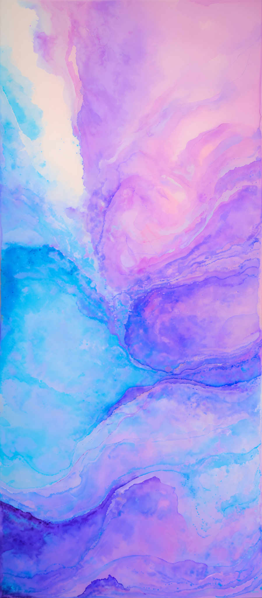 The image showcases a vibrant and fluid artwork. It predominantly features shades of blue, pink, and purple, creating a dreamy and ethereal effect. The shapes are fluid and wavy, reminiscent of waves or abstract representations of natural landscapes. The blending of colors creates a gradient effect, transitioning from a light blue at the top to a deeper purple at the bottom.