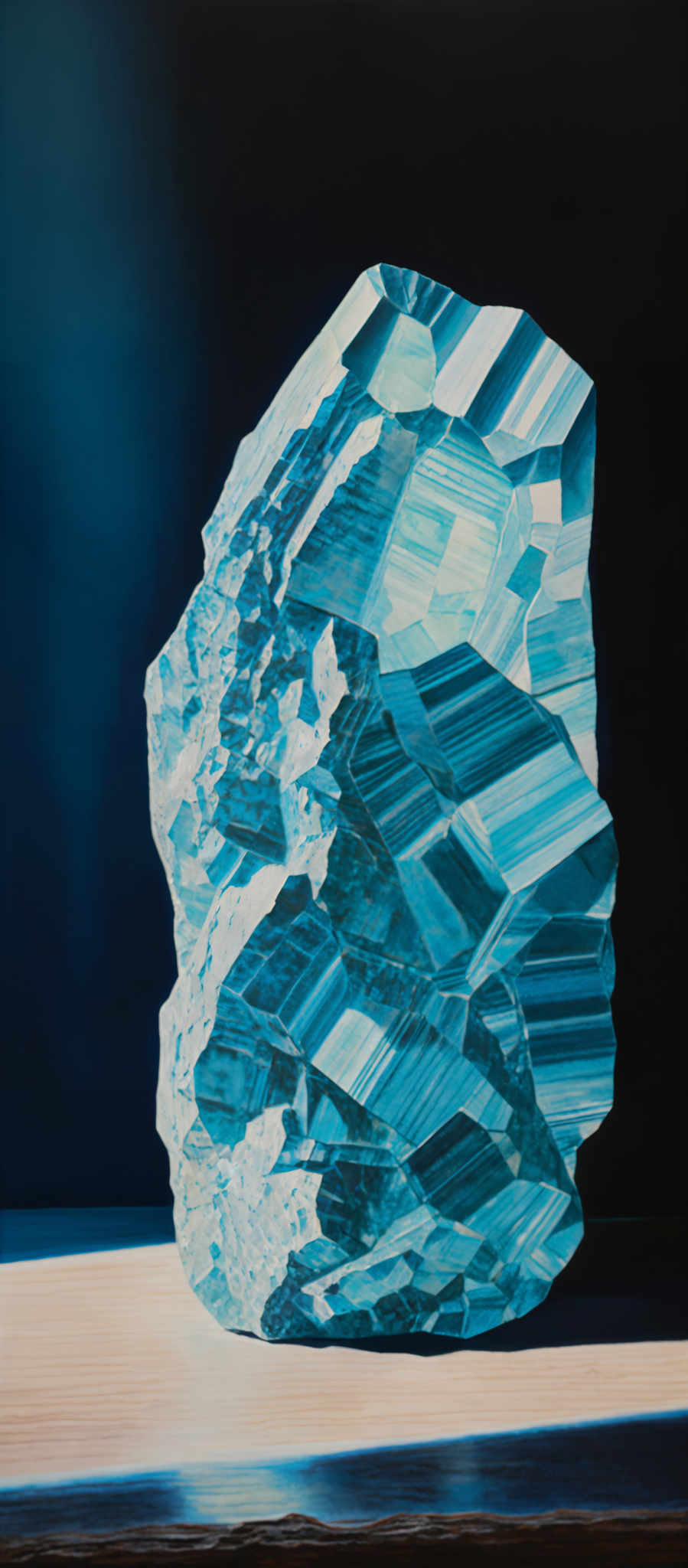 The image showcases a large, intricately detailed crystal or mineral formation. It predominantly features shades of blue, ranging from light to deep, with streaks of white and hints of other colors interspersed. The crystal's shape is irregular, with multiple facets and layers, giving it a complex and multi-dimensional appearance. The background is dark, which accentuates the luminosity and vibrancy of the crystal.